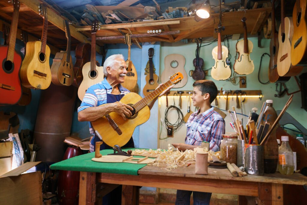 Old Man Grandpa Teaching Boy Grandchild Playing Guitar